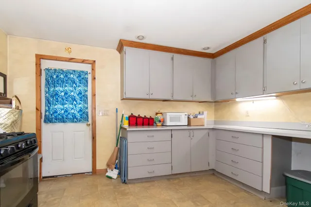 a kitchen with cabinets appliances and cabinets