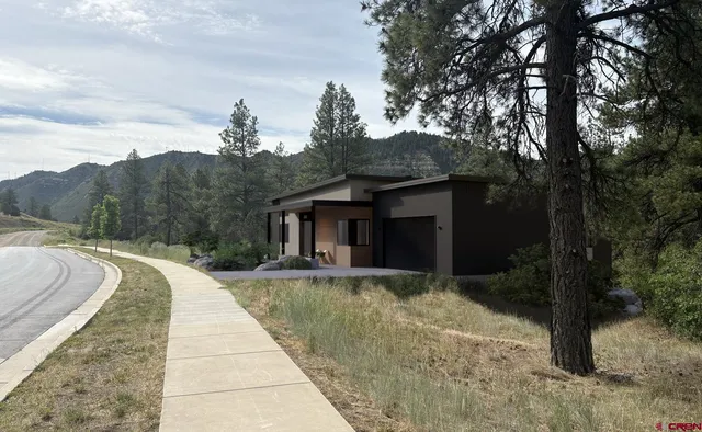 a house view with a backyard space