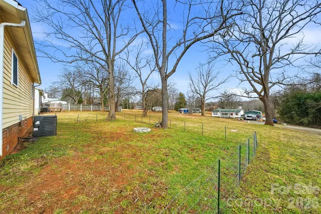 a view of yard with swimming pool