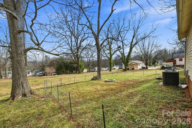 a view of a playground with basketball court