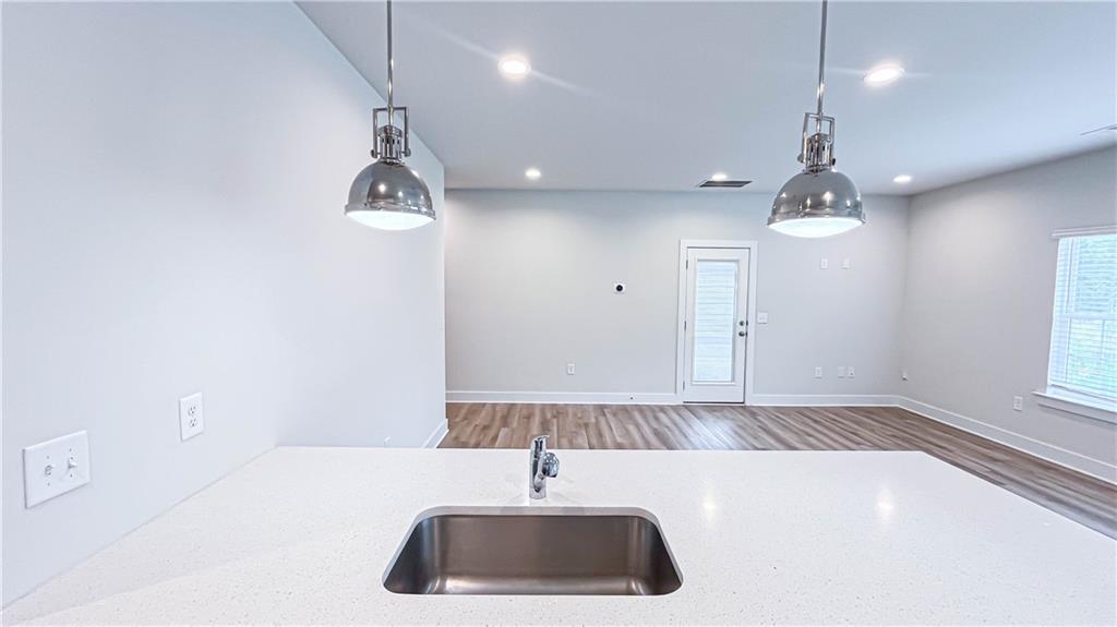 740 Eudora Welty Way Athens, GA 30607 - Photo 21 of 57 a bathroom with a sink a light fixture and a window