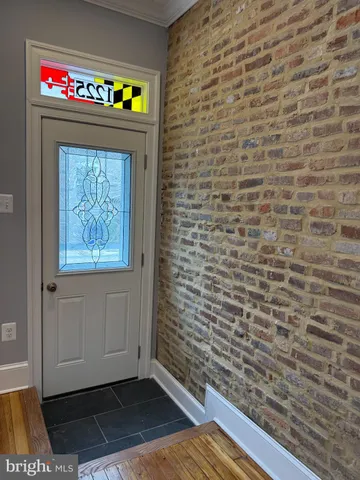 a room with a door and a rug