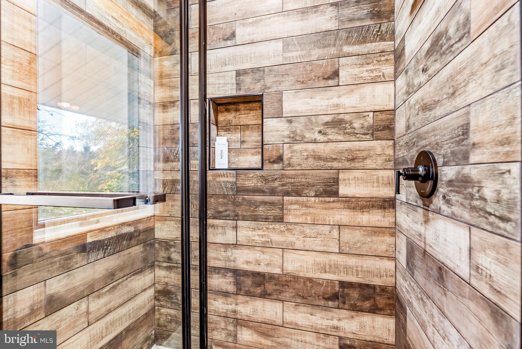 3440 Holland Cliffs Road Huntingtown, MD 20639 - Photo 58 of 75 Walk in shower with glass door and tile surround