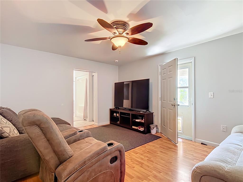 1405 East Clinton Street Bartow, FL 33830 - Photo 15 of 25 a living room with furniture and a flat screen tv