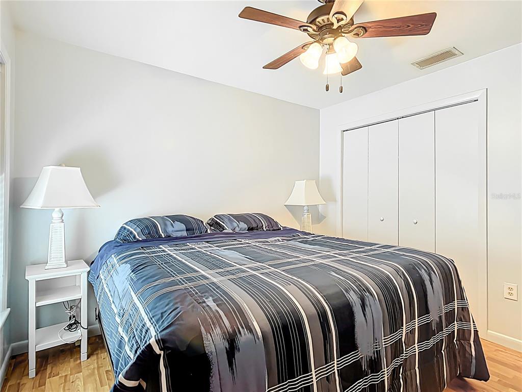 1405 East Clinton Street Bartow, FL 33830 - Photo 18 of 25 a bedroom with a bed and a chandelier