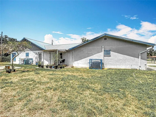 a balcony with table and chairs