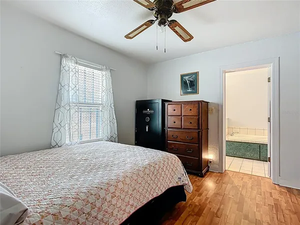 a bathroom with a bathtub and toilet