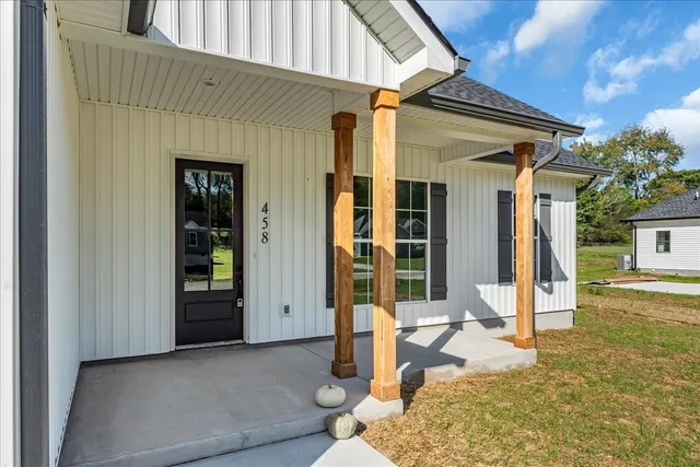a front view of house with small garden
