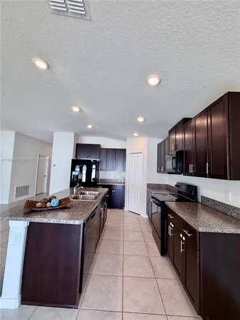 a view of a hallway with wooden shelves