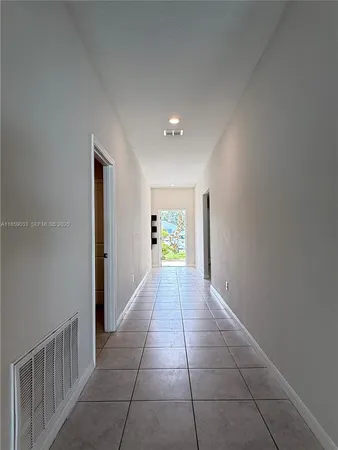 a bathroom with a granite countertop toilet and a sink