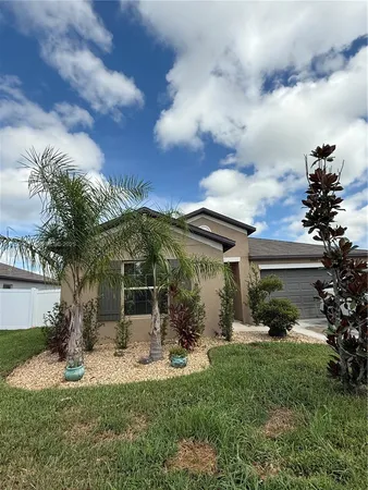 a large kitchen with stainless steel appliances granite countertop a stove top oven a sink dishwasher and a refrigerator