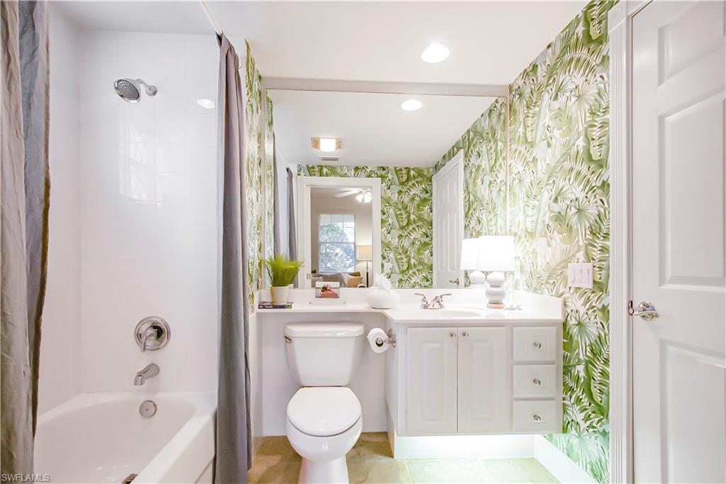 7201 Bellini Way Naples, FL 34114 - Photo 12 of 39 a bathroom with a sink toilet and shower