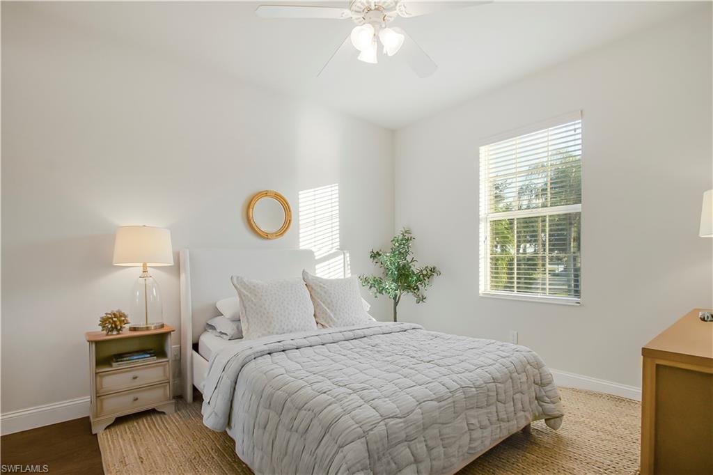7201 Bellini Way Naples, FL 34114 - Photo 19 of 39 a bedroom with bed and window