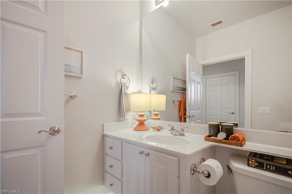 7201 Bellini Way Naples, FL 34114 - Photo 21 of 39 a bathroom with a sink double vanity and a mirror