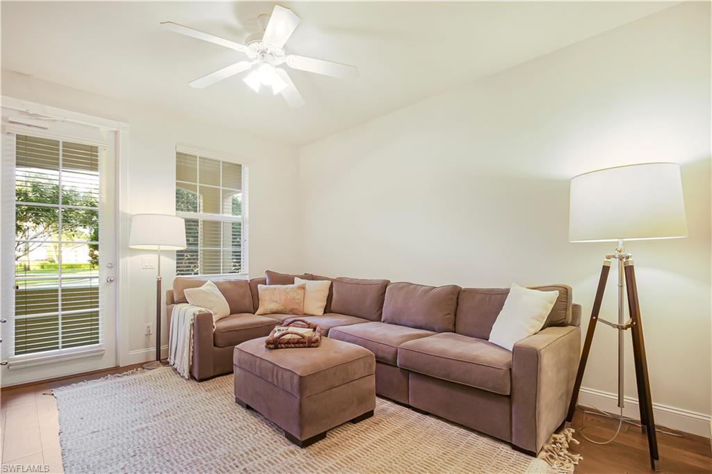 7201 Bellini Way Naples, FL 34114 - Photo 24 of 39 a living room with furniture and a window