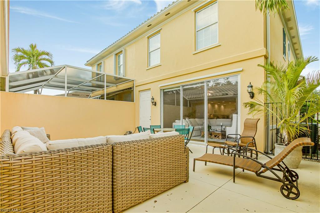7201 Bellini Way Naples, FL 34114 - Photo 28 of 39 a balcony with table and chairs