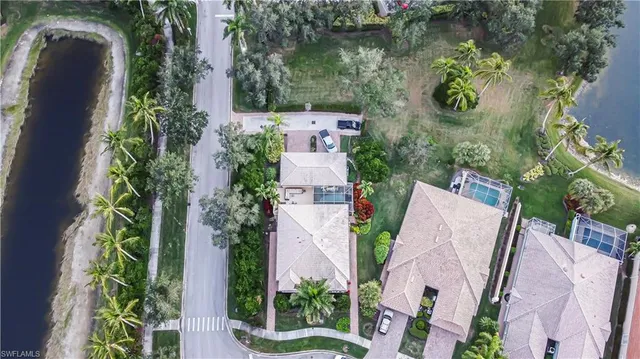 an aerial view of a house with a swimming pool