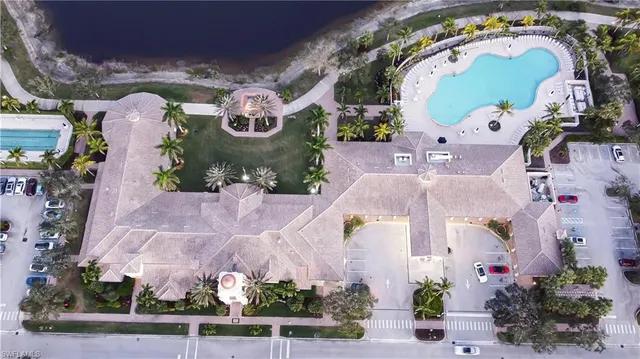 an aerial view of a house with a swimming pool