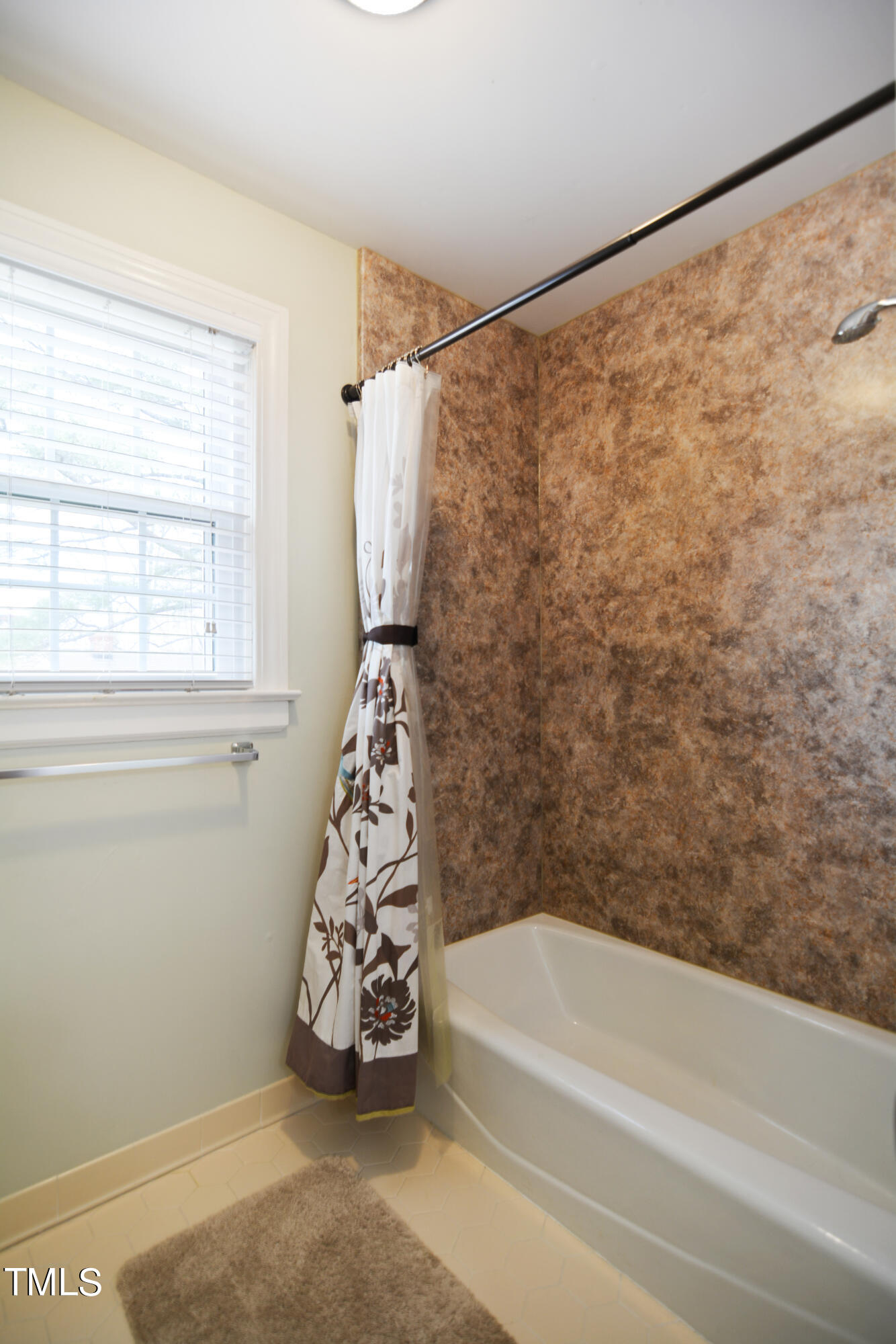 1811 Carrington Drive Raleigh, NC 27615 - Photo 18 of 23 a bathroom with a bathtub and a shower