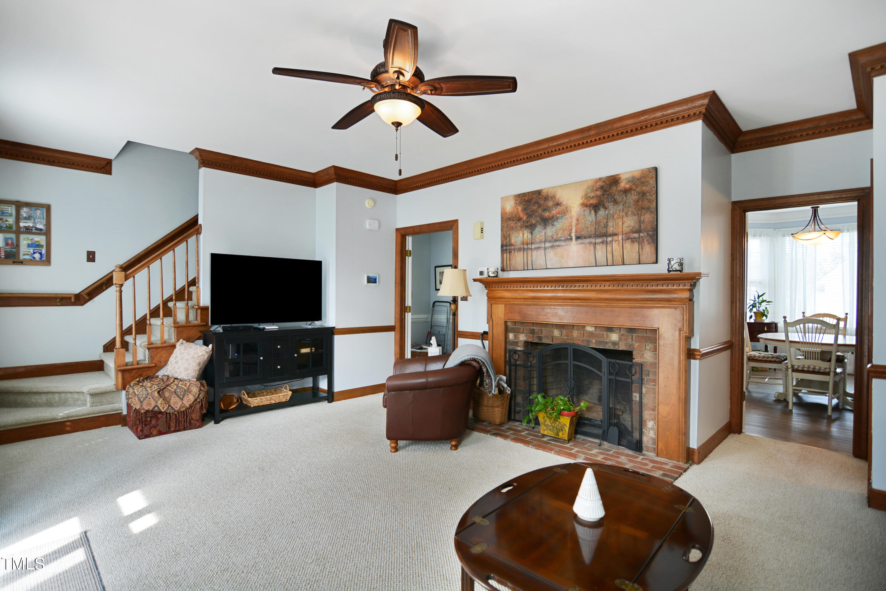 1811 Carrington Drive Raleigh, NC 27615 - Photo 3 of 23 a living room with furniture and a fireplace