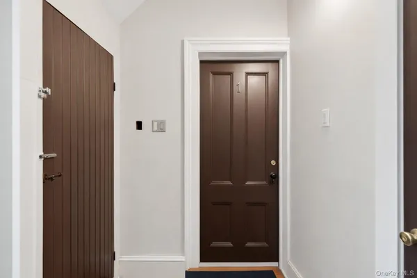 a kitchen with cabinets and wooden floor