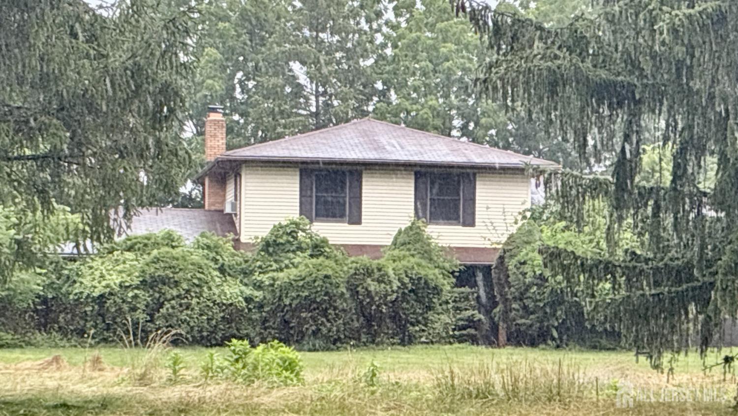 143 Back Brook Road Ringoes, NJ 08551 - Photo 2 of 25 a front view of a house with garden