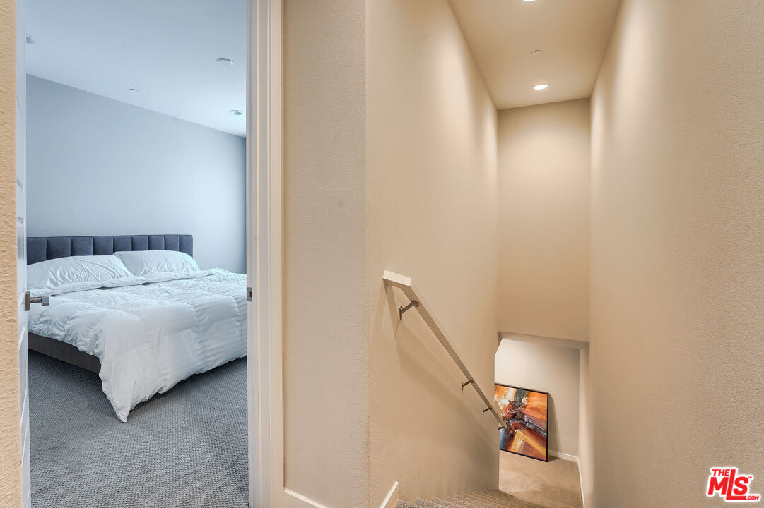 237 Magnet Irvine, CA 92618 - Photo 11 of 34 a bedroom with a bed and a painting on the wall