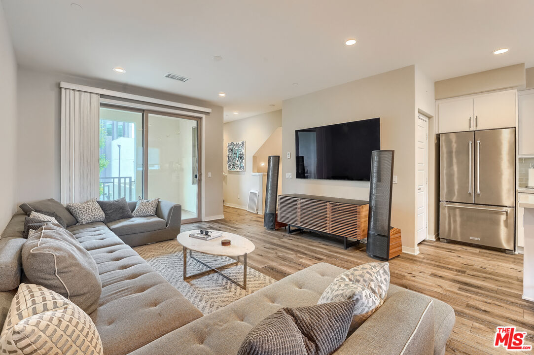 237 Magnet Irvine, CA 92618 - Photo 2 of 34 a living room with furniture and a flat screen tv