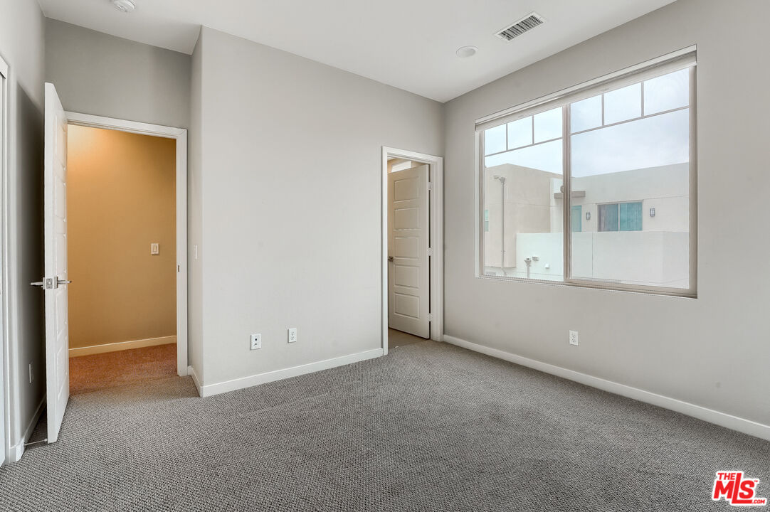 237 Magnet Irvine, CA 92618 - Photo 24 of 34 an empty room with windows and closet