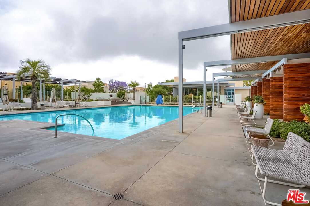 237 Magnet Irvine, CA 92618 - Photo 31 of 34 a view of a patio with a table and chairs
