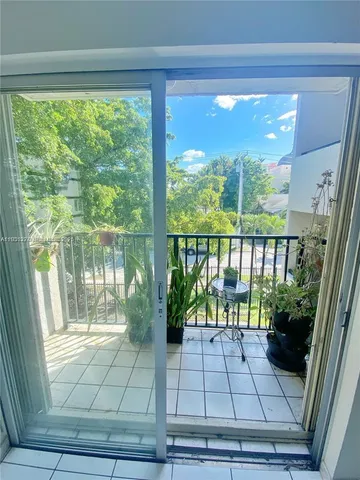 a view of balcony with furniture