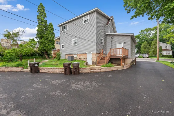 a view of a house with a yard and garage