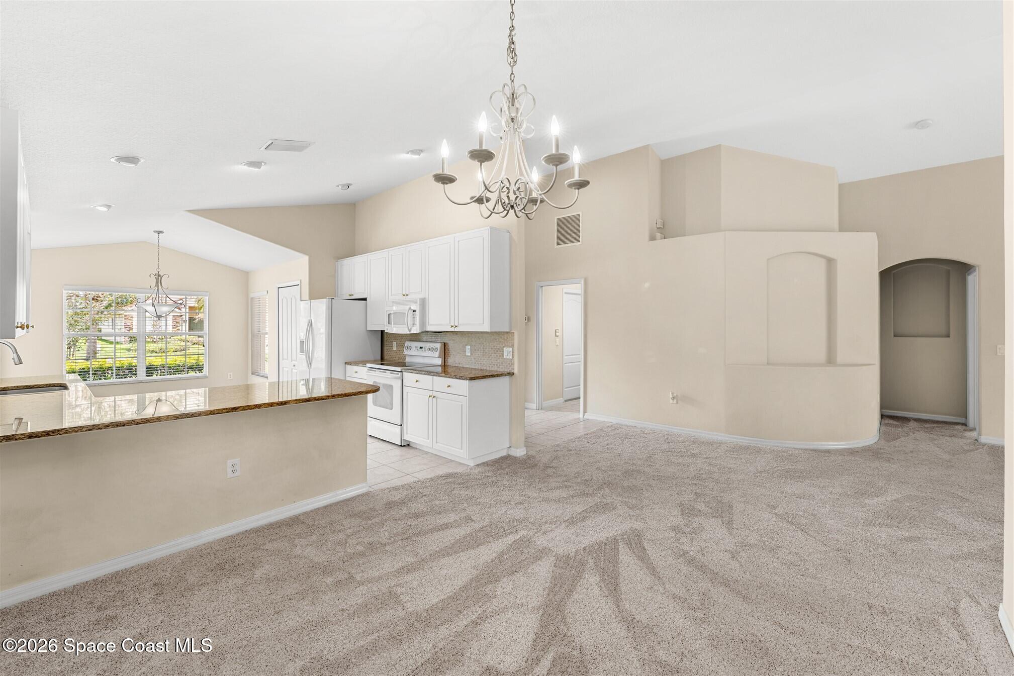 6904 Renshaw Drive Melbourne, FL 32940 - Photo 10 of 46 a view of kitchen with furniture and window