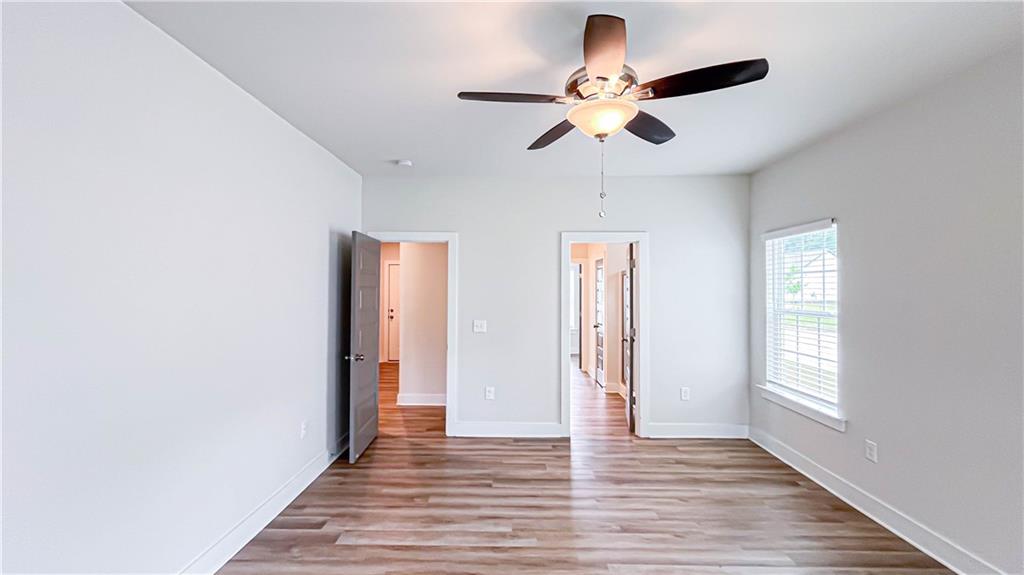 740 Eudora Welty Way Athens, GA 30607 - Photo 24 of 57 a view of an empty room with wooden floor and a window