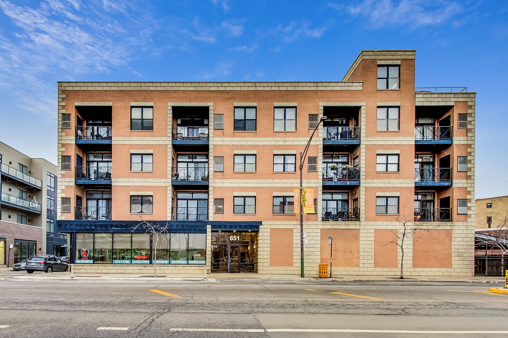 a front view of a building with a street