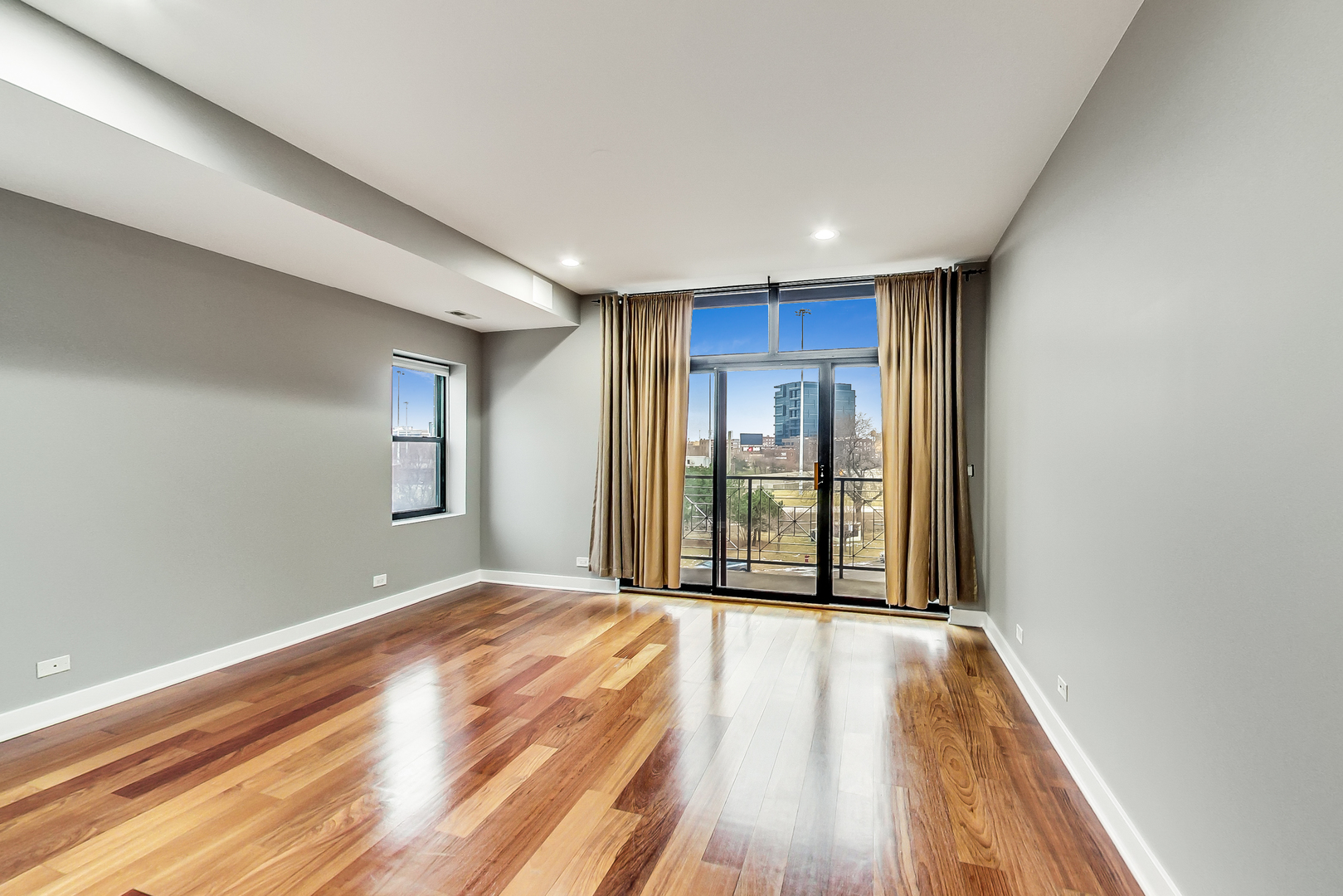 651 North Milwaukee Avenue, Unit 304 Chicago, IL 60642 - Photo 14 of 33 a view of a livingroom with wooden floor