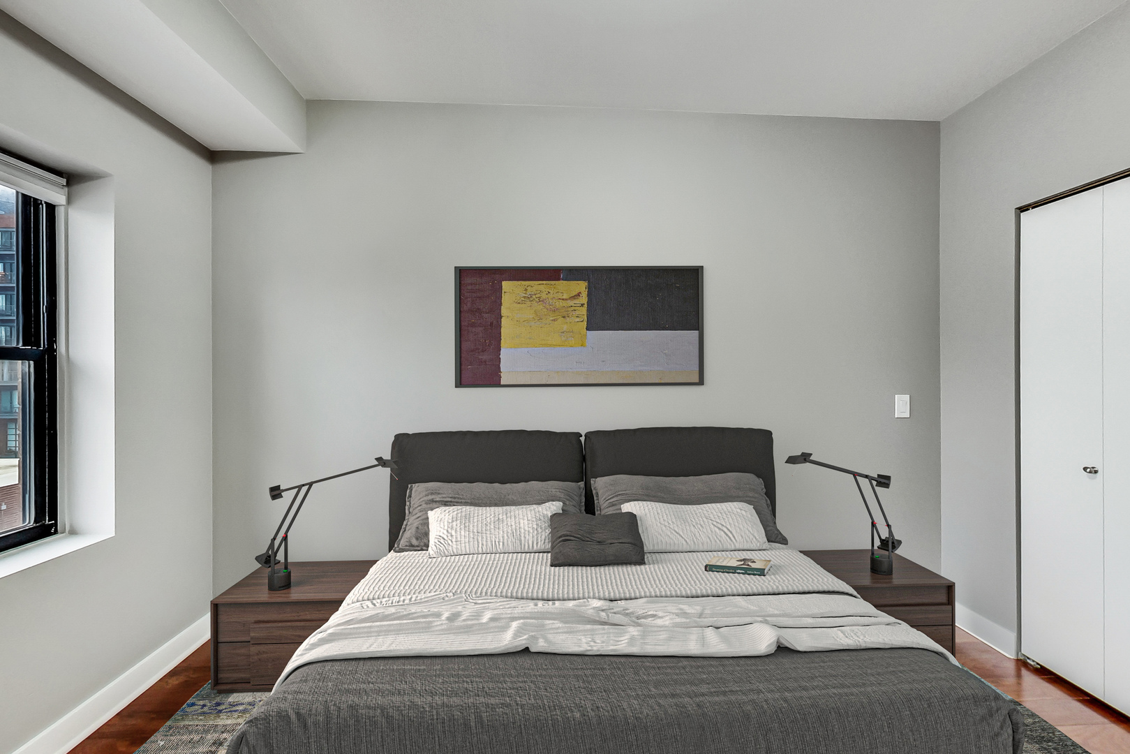 651 North Milwaukee Avenue, Unit 304 Chicago, IL 60642 - Photo 21 of 33 a bedroom with a bed and painting on the wall