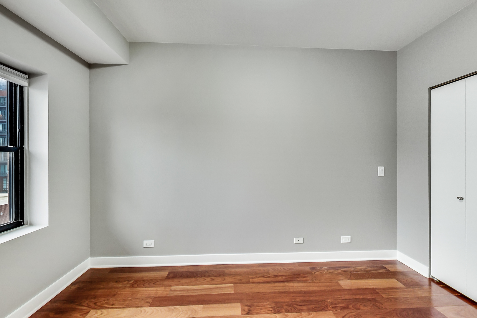 651 North Milwaukee Avenue, Unit 304 Chicago, IL 60642 - Photo 22 of 33 a view of room with window and wooden floor