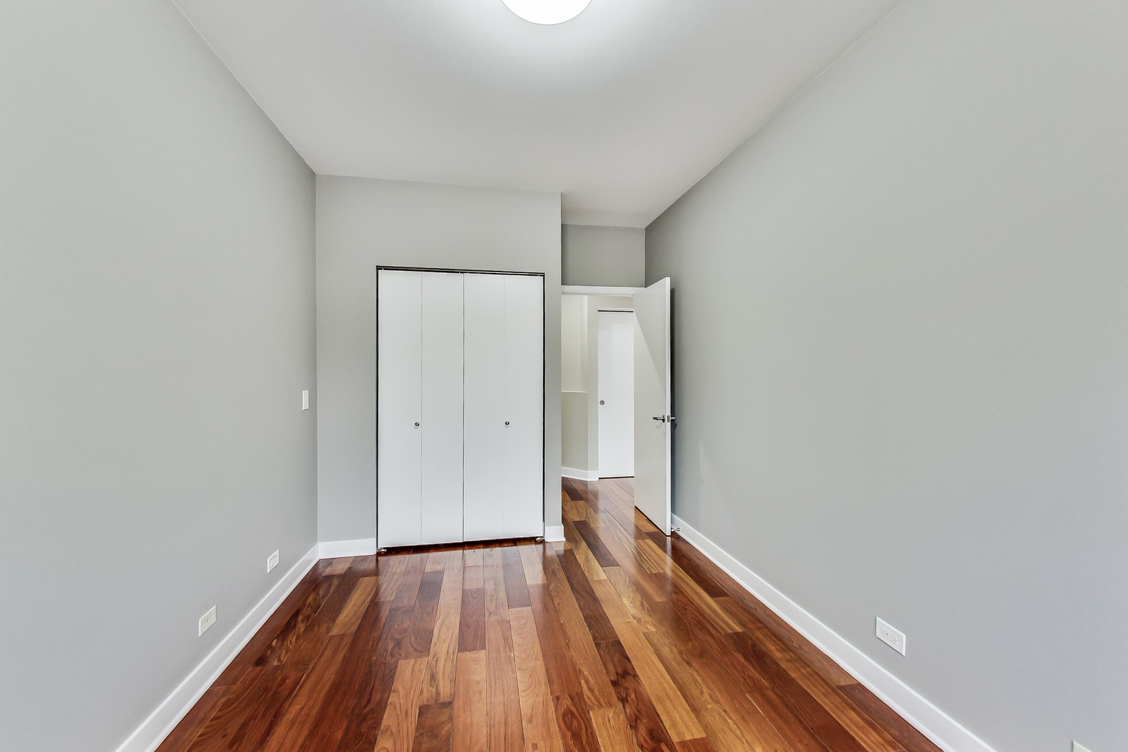 651 North Milwaukee Avenue, Unit 304 Chicago, IL 60642 - Photo 24 of 33 a view of a room with wooden floor