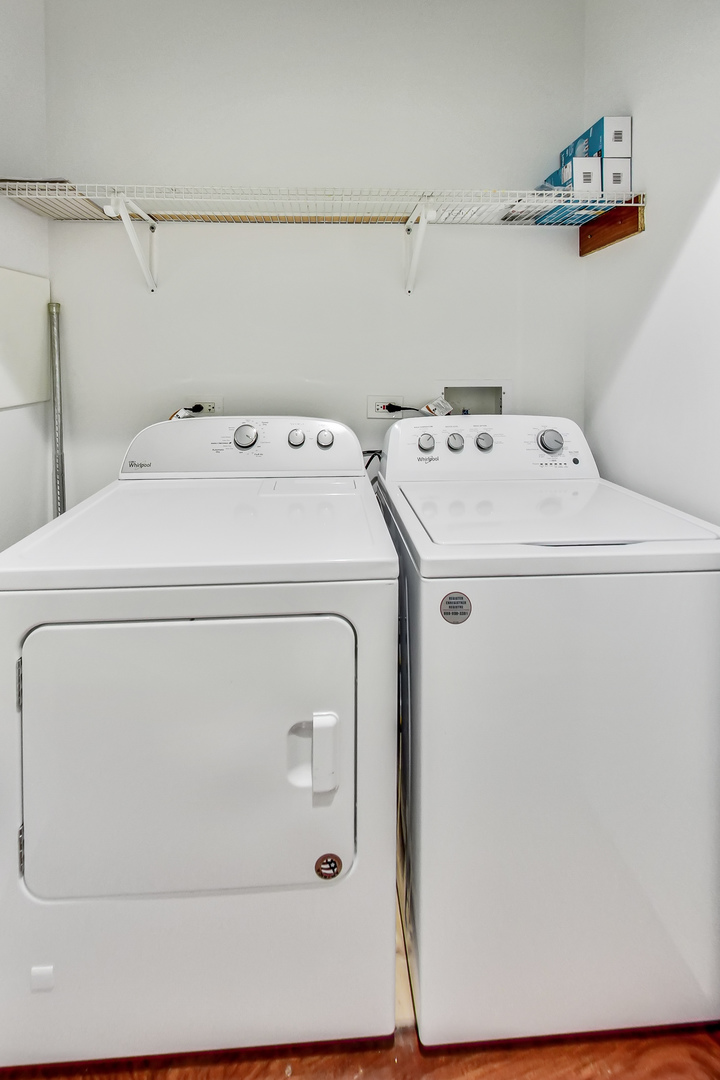 651 North Milwaukee Avenue, Unit 304 Chicago, IL 60642 - Photo 26 of 33 a utility room with dryer and washer