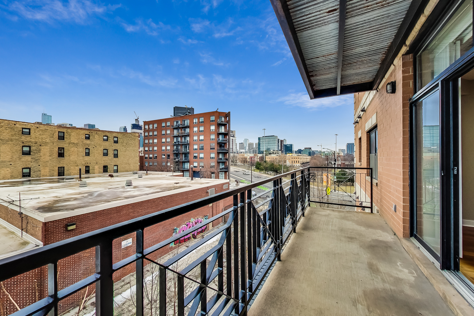651 North Milwaukee Avenue, Unit 304 Chicago, IL 60642 - Photo 28 of 33 a view of balcony with wooden floor