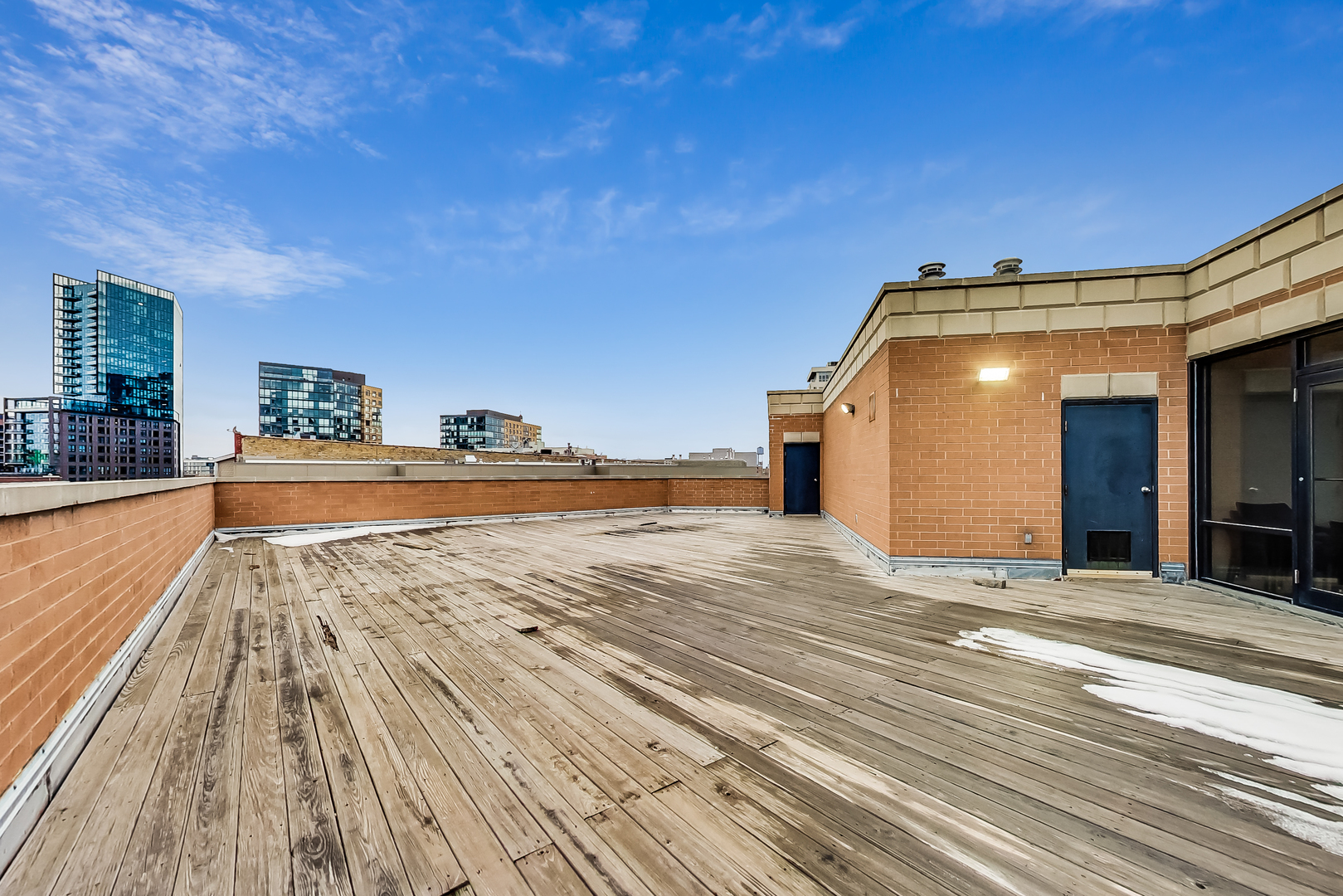 651 North Milwaukee Avenue, Unit 304 Chicago, IL 60642 - Photo 32 of 33 a view of a living room and kitchen floor