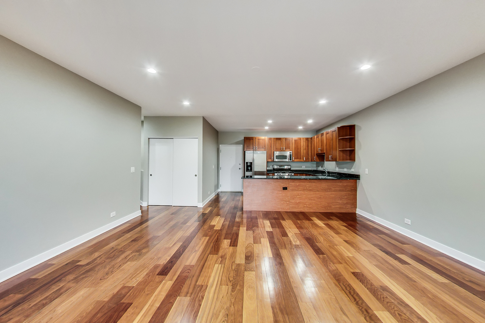 651 North Milwaukee Avenue, Unit 304 Chicago, IL 60642 - Photo 8 of 33 a view of kitchen with kitchen island and stainless steel appliances