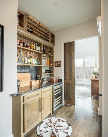 a kitchen with a refrigerator and a stove top oven