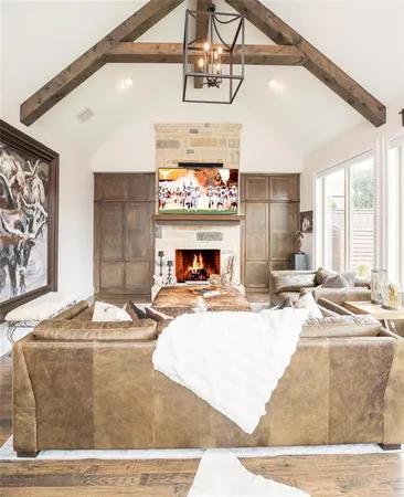 a living room with fireplace furniture and a fireplace