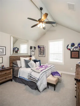 a bedroom with bed and window