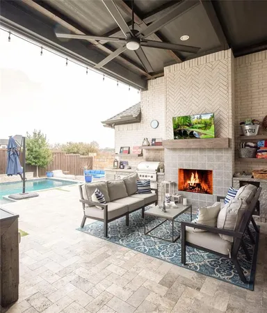a outdoor living space with patio furniture and a fireplace