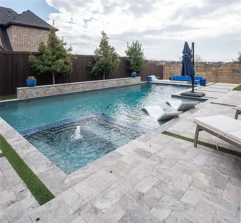 a view of a swimming pool with a patio