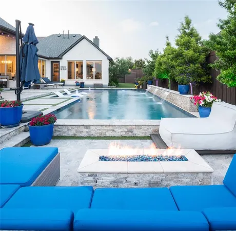 a view of a house with pool table and chairs