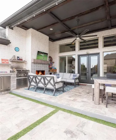a living room with lots of furniture and a fireplace